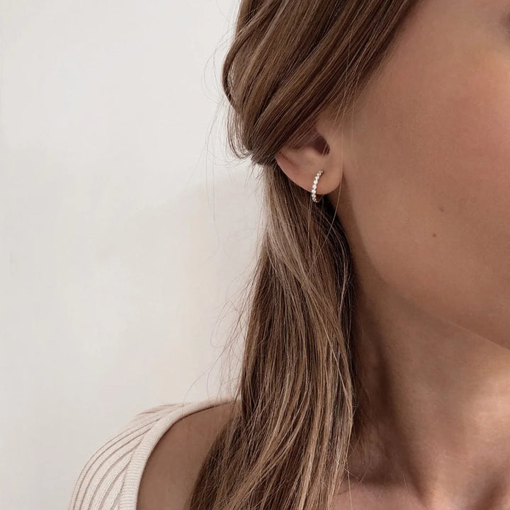 hoop huggie earrings with cz made in waterproof 14k gold plated steel from icône 