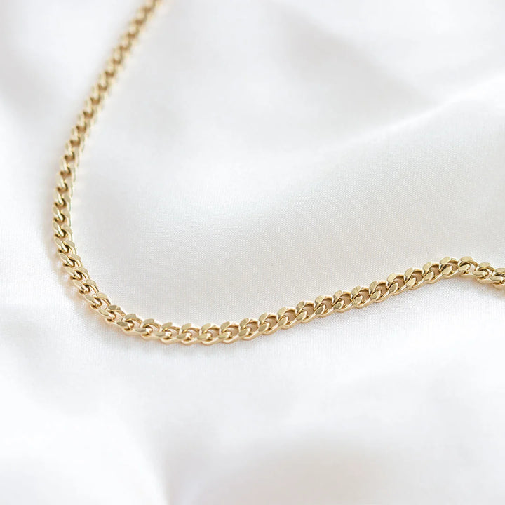 thin cuban curb bracelet made in waterproof 14k gold plated steel from icône 